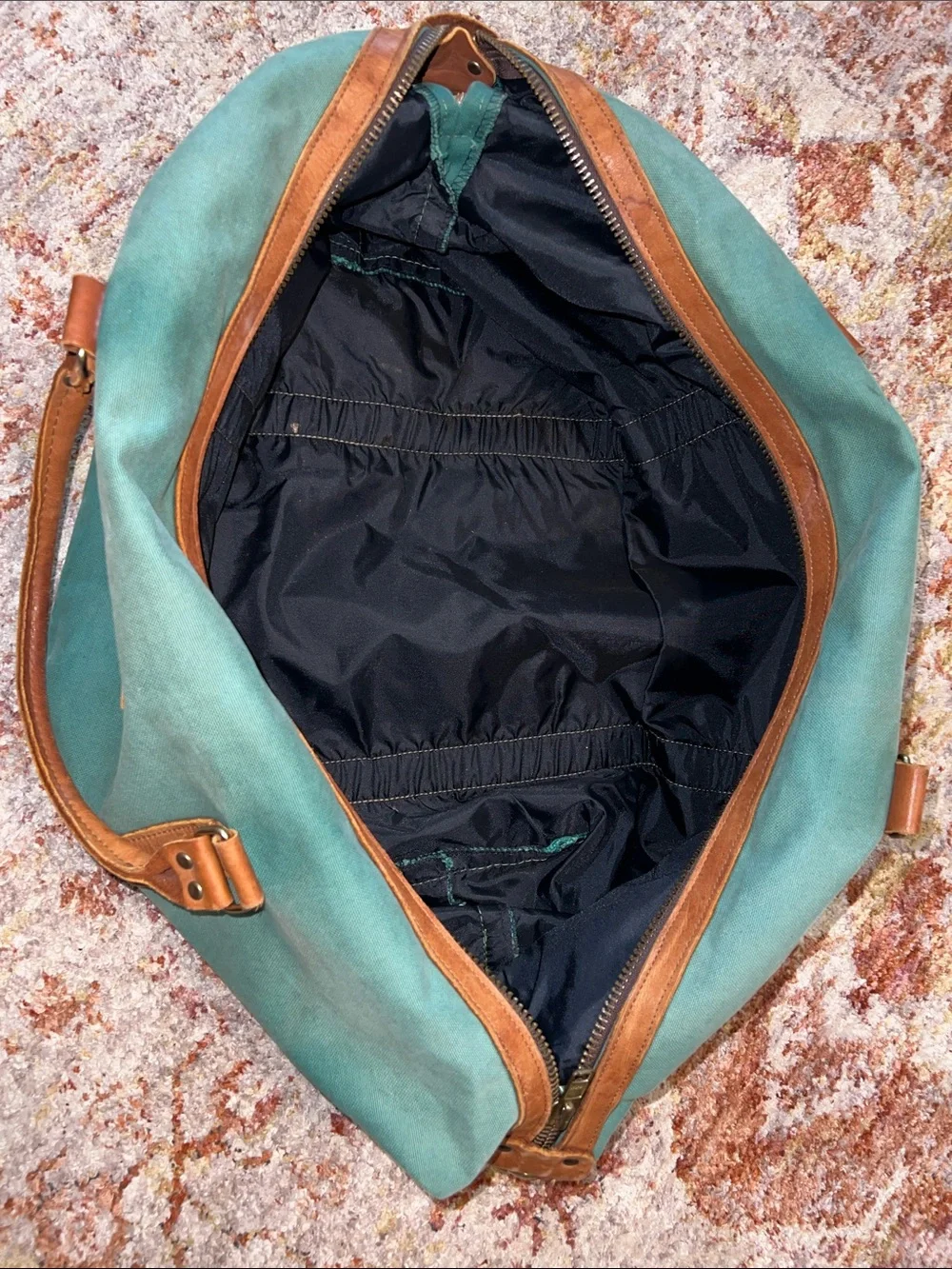 Vintage green duffle bag with leather handles